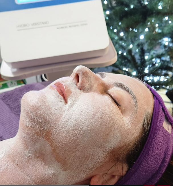 Client receiving a professional facial treatment at Kat's Beauty